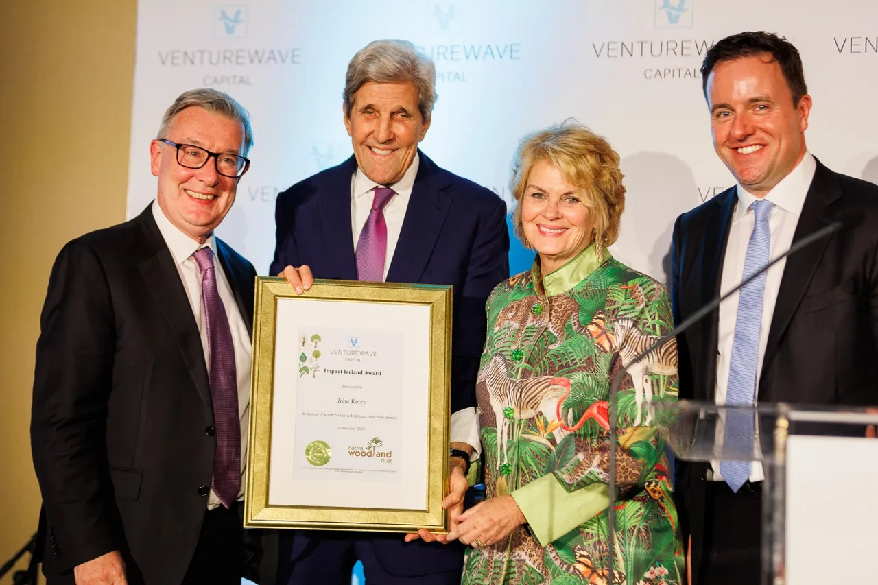 John Kerry holding his Impact Ireland Award at the 2024 presentation
