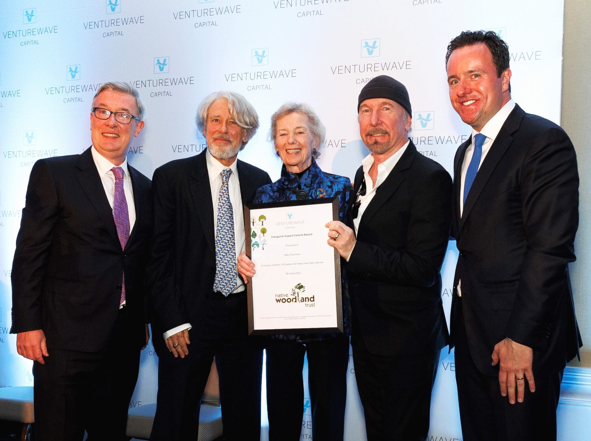 Mary Robinson with her award alongside Kieran McLoughlin, Adam Clayton, The Edge and Alan Foy